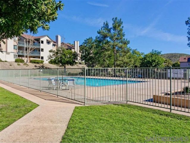 a view of a pathway with a yard