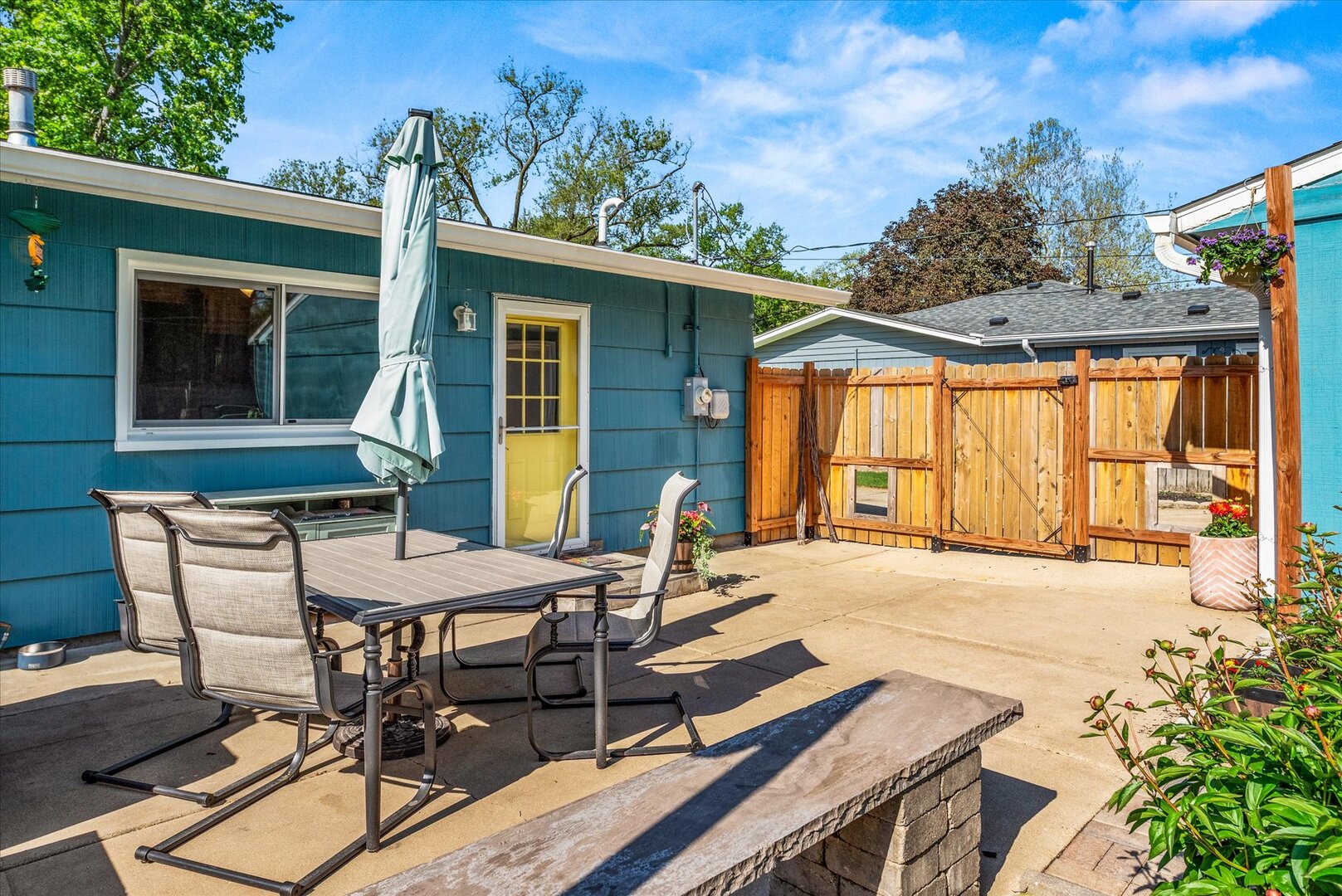 14 Hampton Road Montgomery, IL 60538 - Photo 20 of 27 a view of a patio with table and chairs with wooden floor and fence