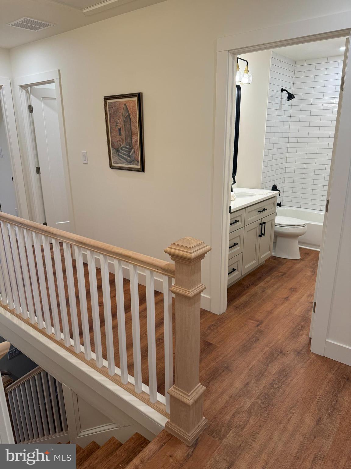 202 Chestnut Street Brooklawn, NJ 08030 - Photo 15 of 29 a bathroom with a toilet sink and a mirror