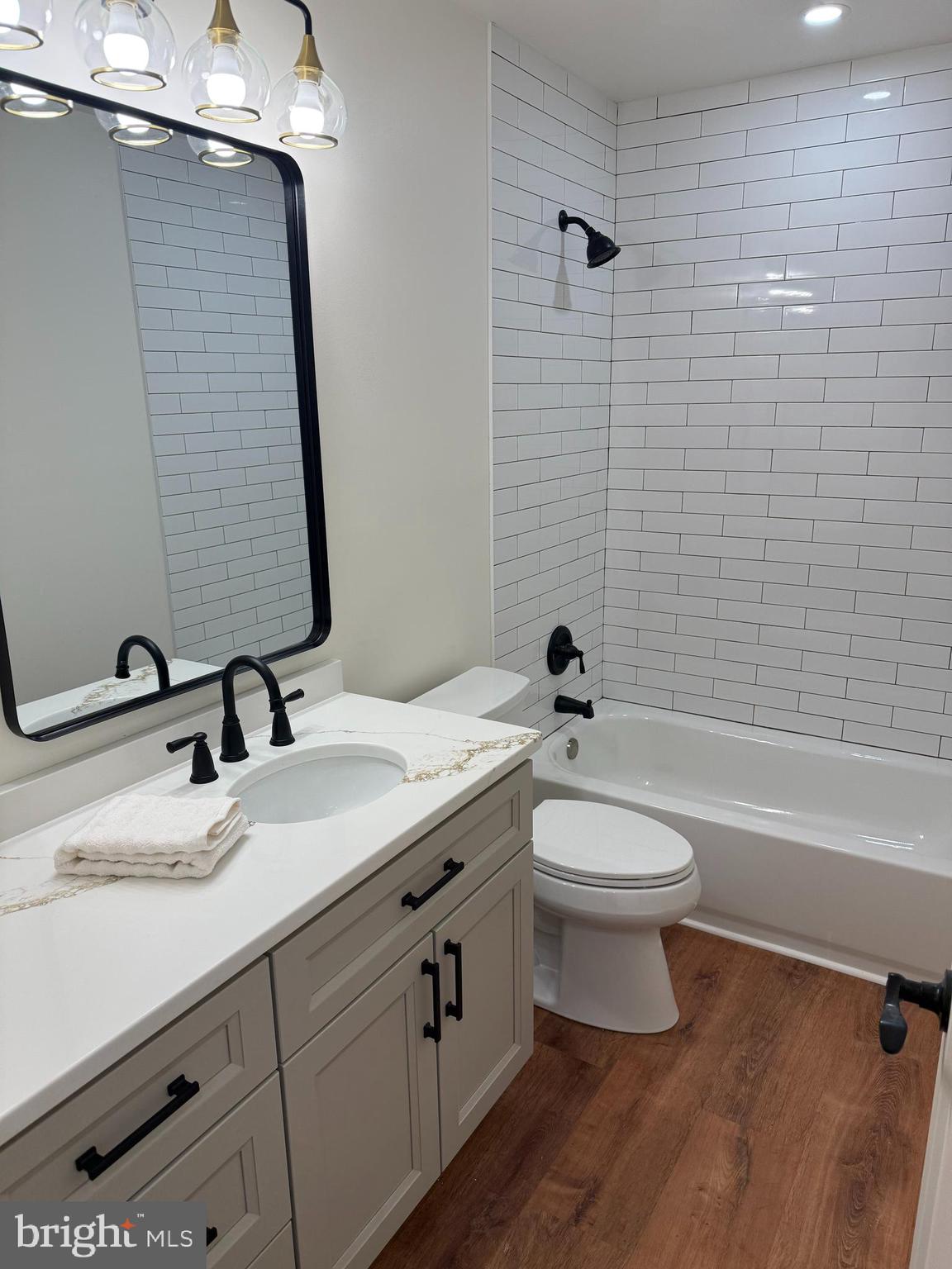 202 Chestnut Street Brooklawn, NJ 08030 - Photo 17 of 29 a bathroom with a double vanity sink toilet and shower
