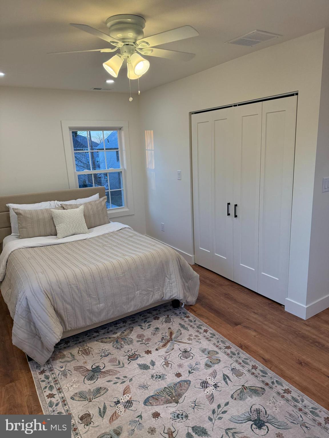 202 Chestnut Street Brooklawn, NJ 08030 - Photo 22 of 29 a bedroom with a bed and a chandelier