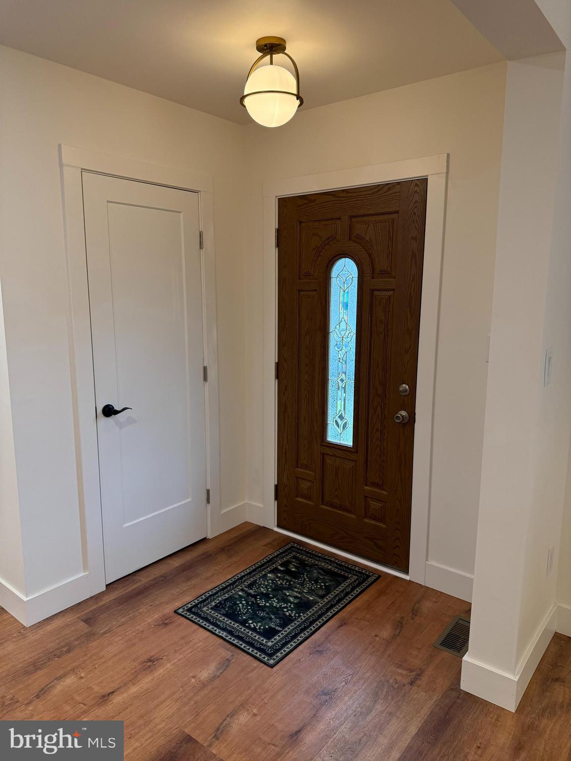 202 Chestnut Street Brooklawn, NJ 08030 - Photo 4 of 29 a view of a entryway door with wooden floor