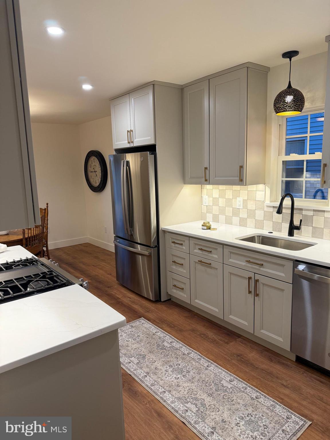 202 Chestnut Street Brooklawn, NJ 08030 - Photo 10 of 29 a kitchen with stainless steel appliances granite countertop a sink stove and refrigerator