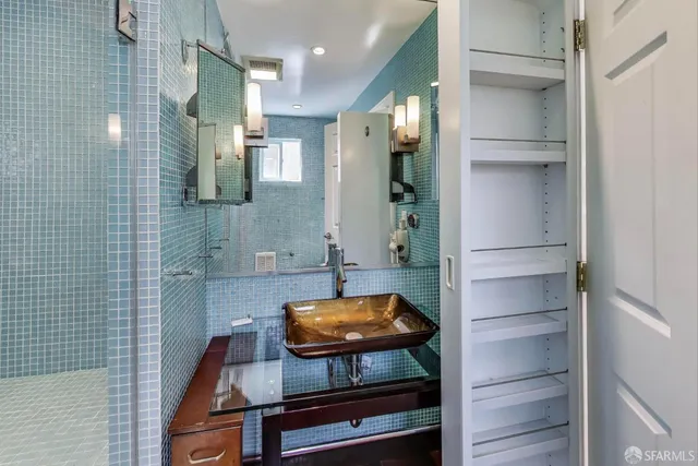 a bathroom with a sink and a mirror
