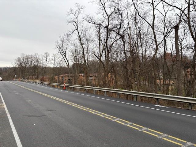 0 Library Road Bethel Park, PA 15102 - Photo 10 of 16 a view of a city street with a building and trees in the background