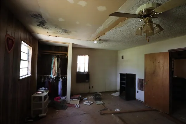 a view of a livingroom with furniture and windows