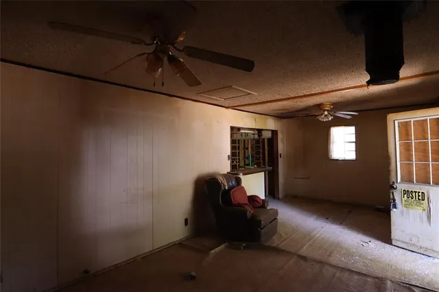 a room with gym equipment and a window