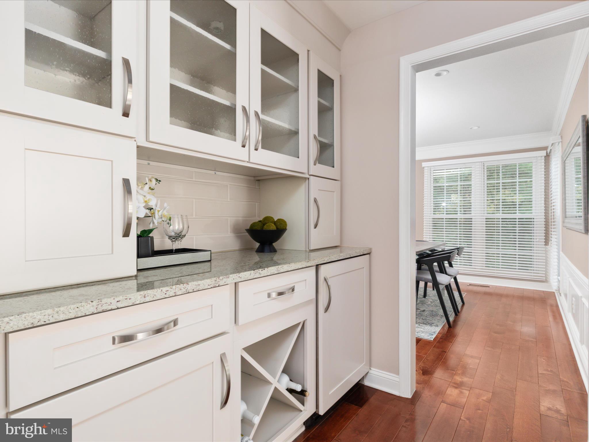 20462 Quarterpath Trace Circle Sterling, VA 20165 - Photo 11 of 58 a white kitchen with a sink and cabinets