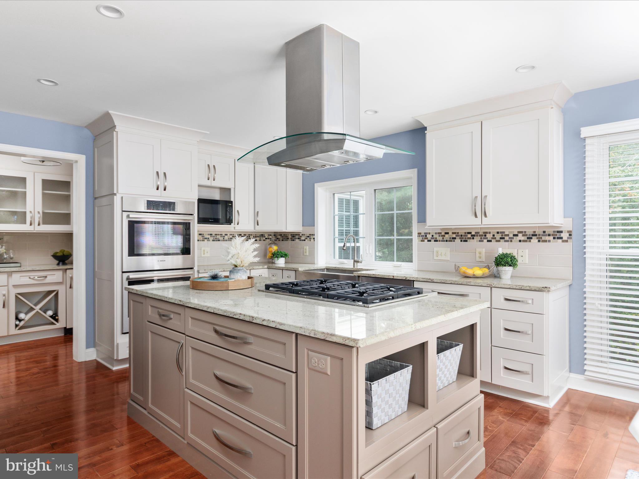20462 Quarterpath Trace Circle Sterling, VA 20165 - Photo 12 of 58 a kitchen with stainless steel appliances a stove a sink and a refrigerator