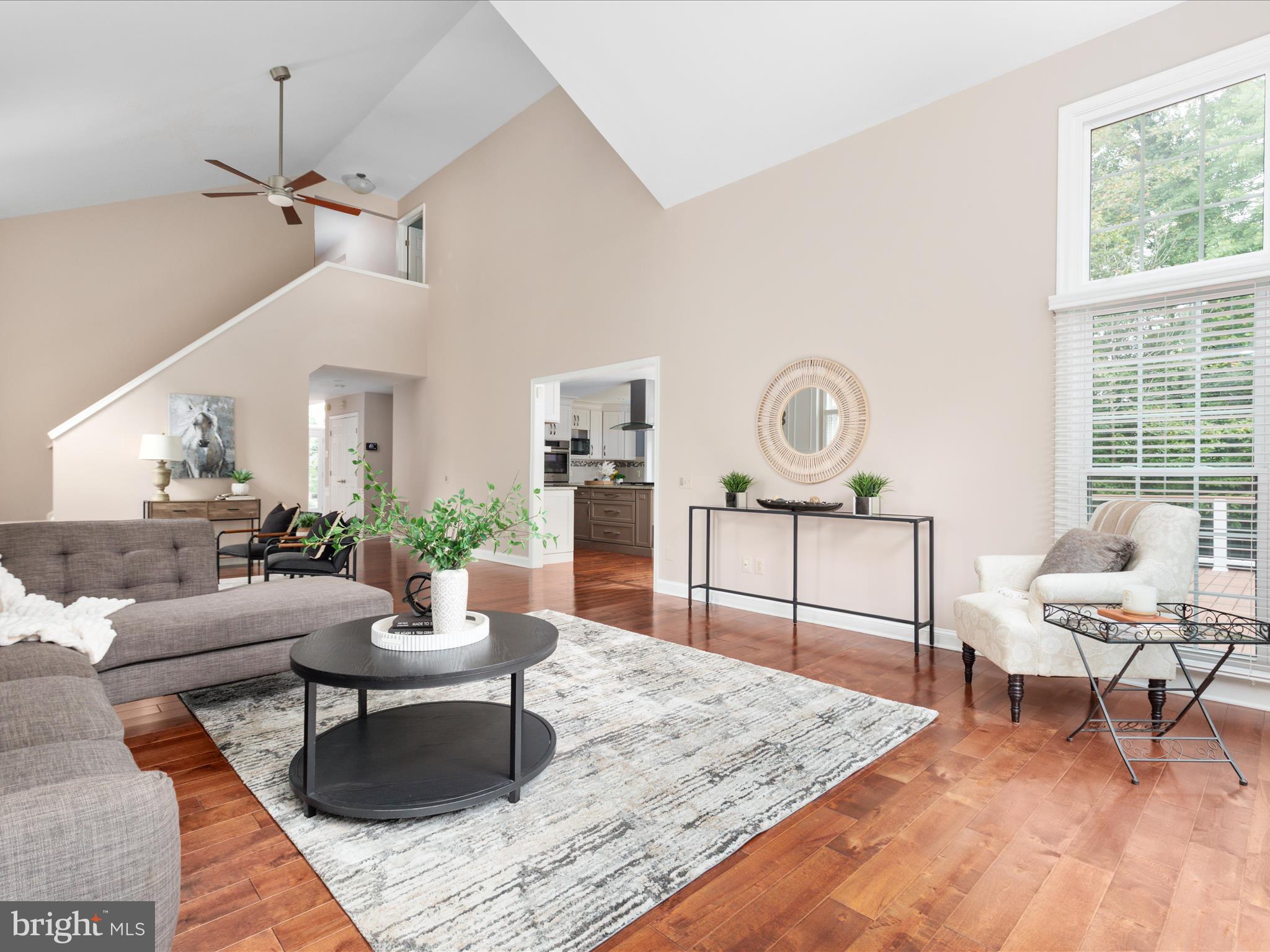 20462 Quarterpath Trace Circle Sterling, VA 20165 - Photo 18 of 58 a living room with furniture and a table