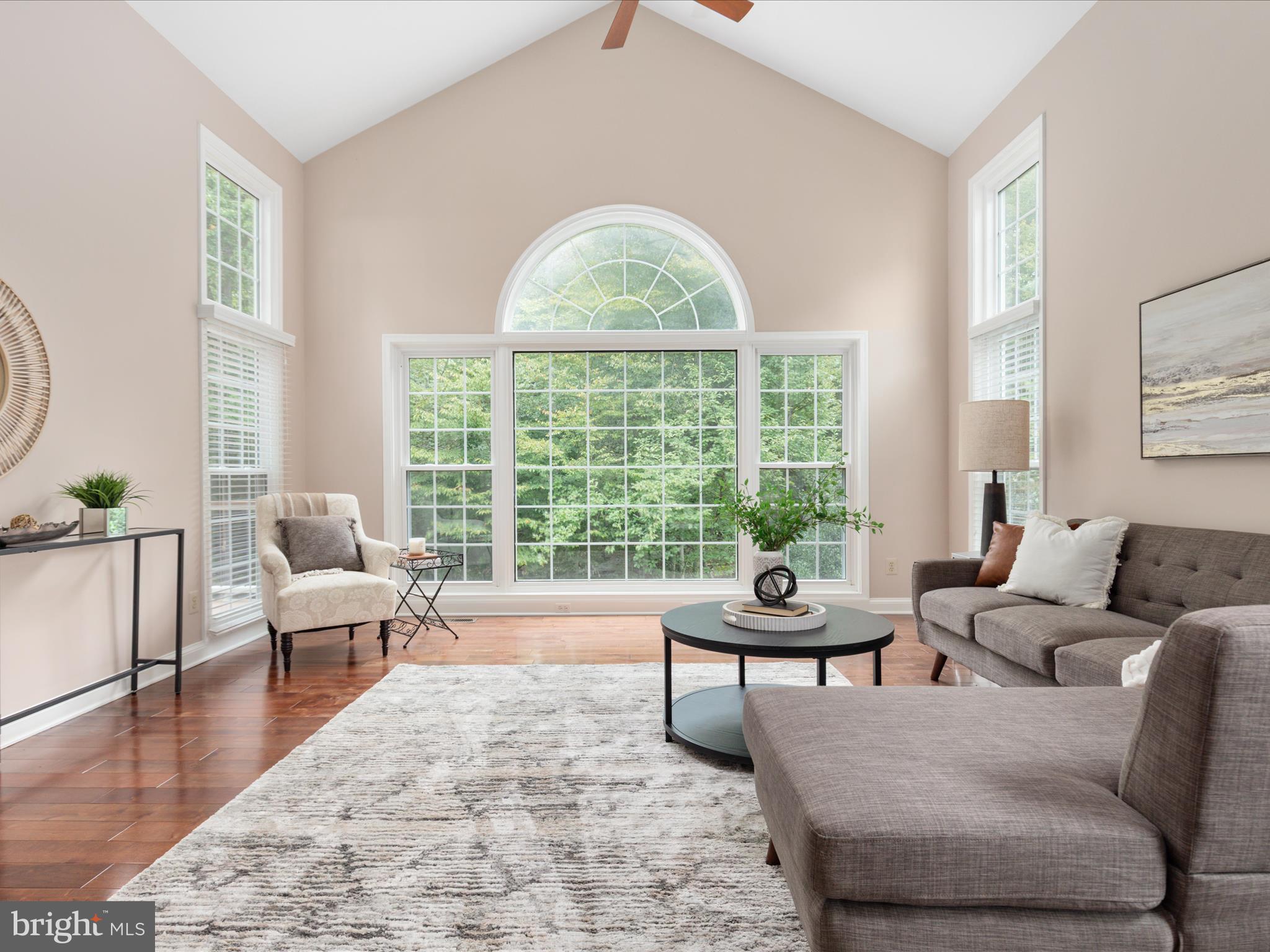 20462 Quarterpath Trace Circle Sterling, VA 20165 - Photo 20 of 58 a living room with furniture and a large window