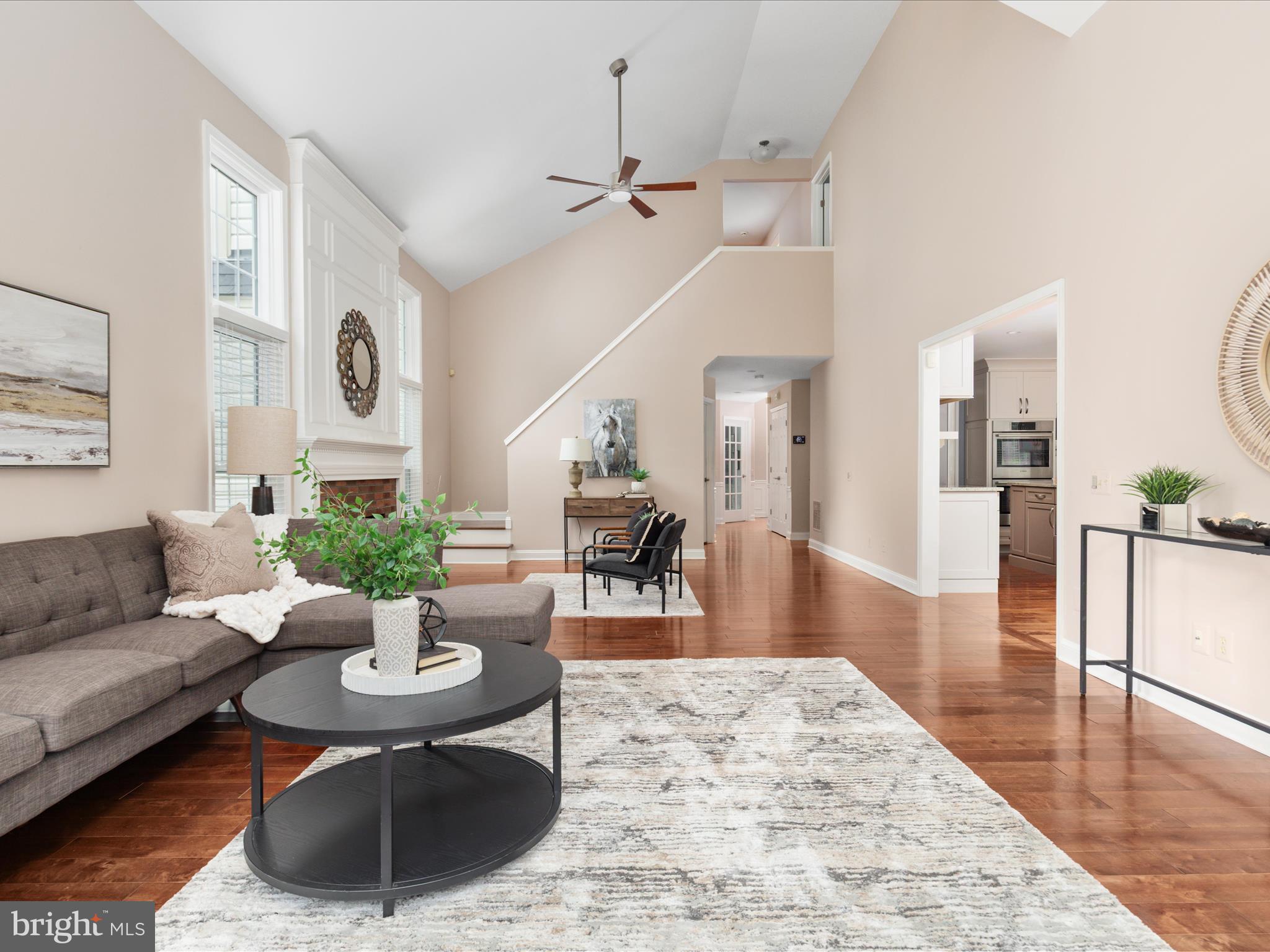 20462 Quarterpath Trace Circle Sterling, VA 20165 - Photo 21 of 58 a living room with furniture and wooden floor