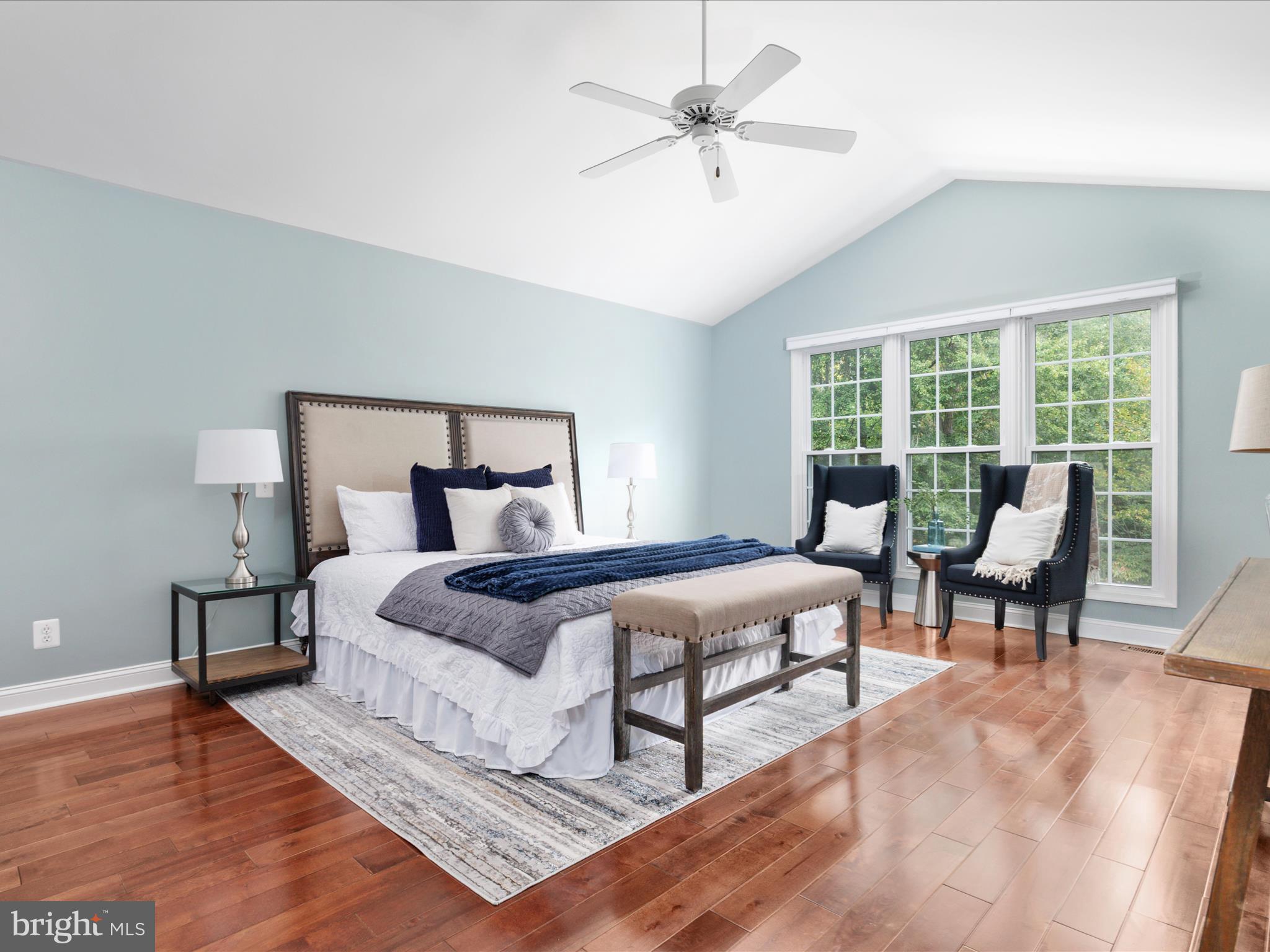 20462 Quarterpath Trace Circle Sterling, VA 20165 - Photo 26 of 58 a bedroom with a bed a large window with table and chair