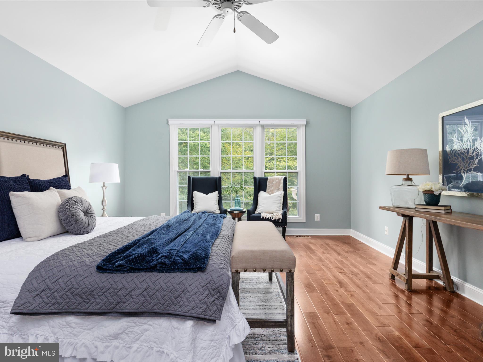 20462 Quarterpath Trace Circle Sterling, VA 20165 - Photo 27 of 58 a bedroom with a bed and wooden floor