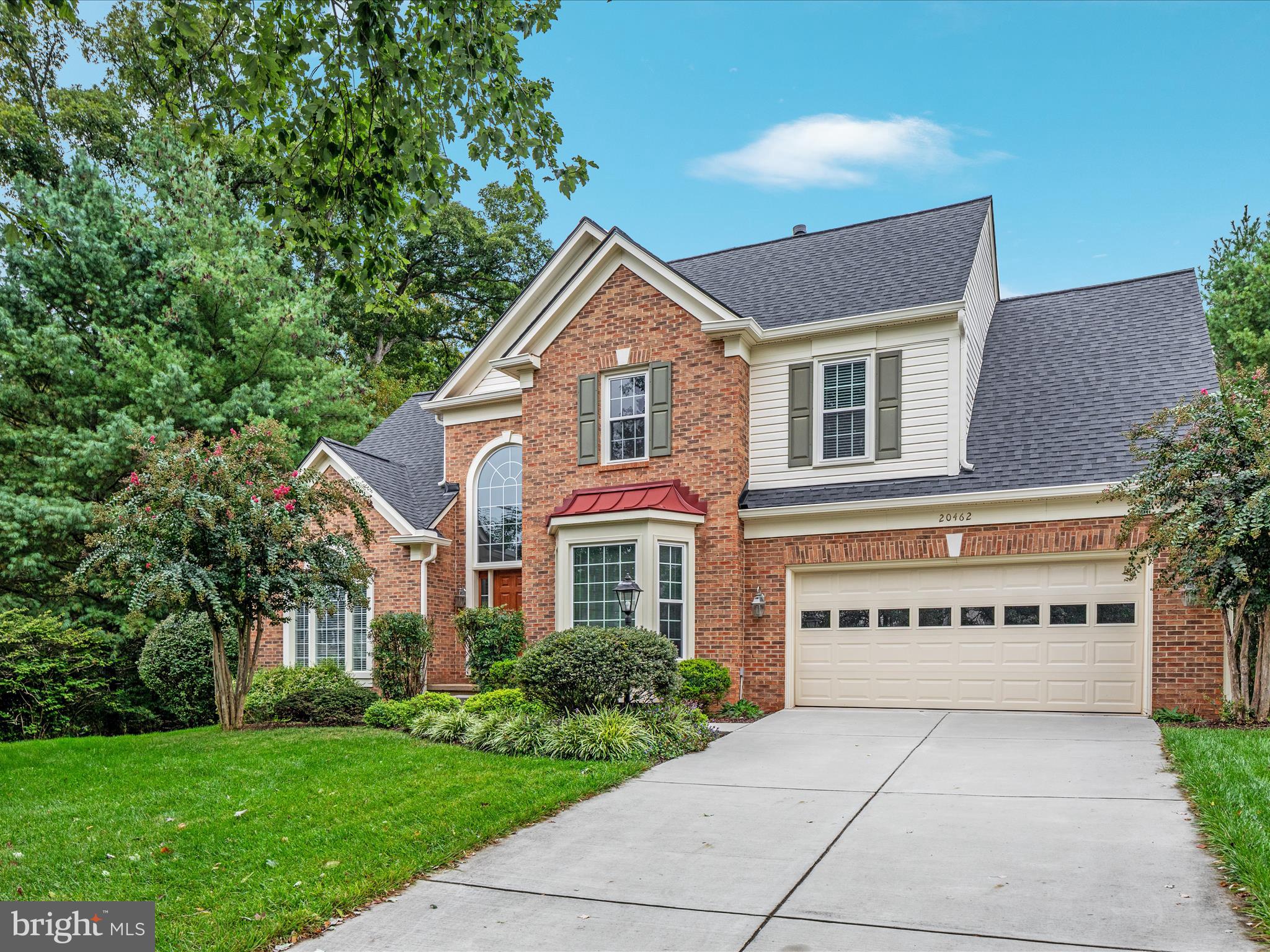 20462 Quarterpath Trace Circle Sterling, VA 20165 - Photo 3 of 58 a front view of a house with a garden