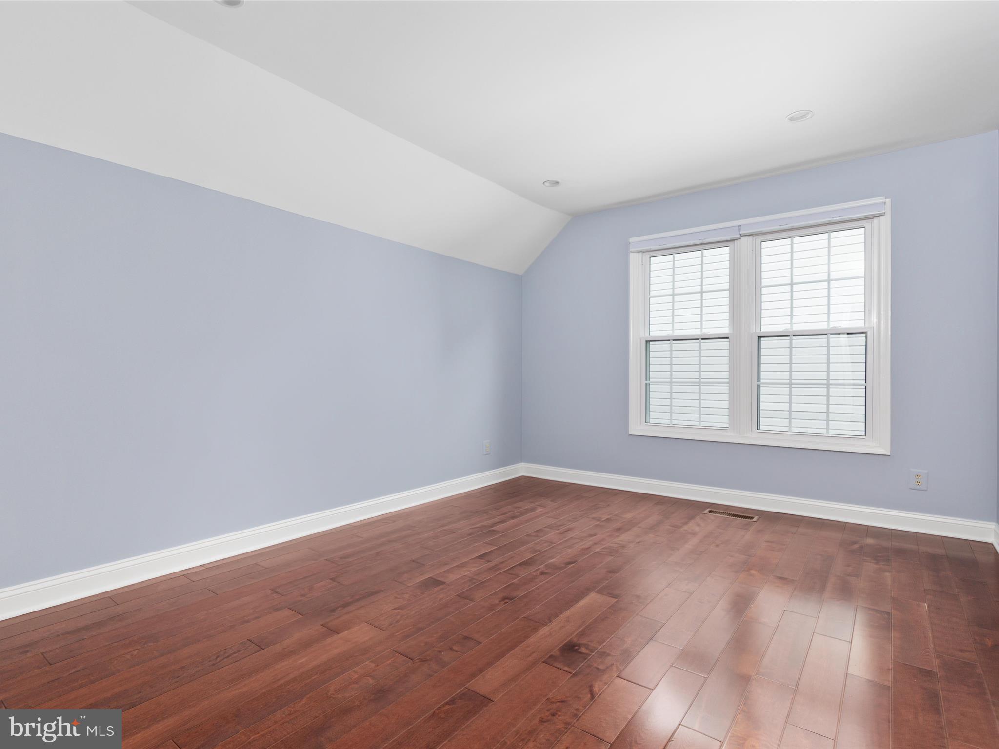 20462 Quarterpath Trace Circle Sterling, VA 20165 - Photo 34 of 58 an empty room with wooden floor and windows