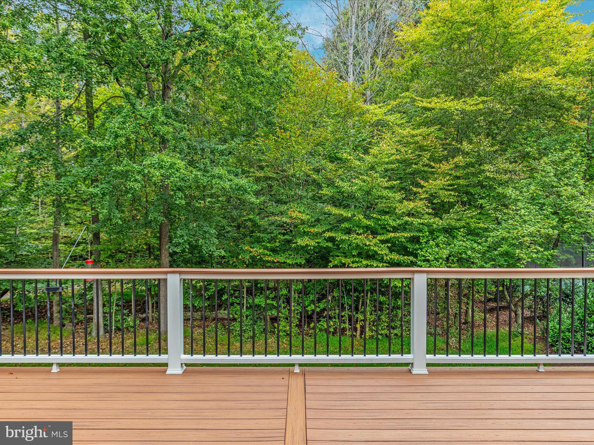 20462 Quarterpath Trace Circle Sterling, VA 20165 - Photo 48 of 58 a view of a wooden fence and trees