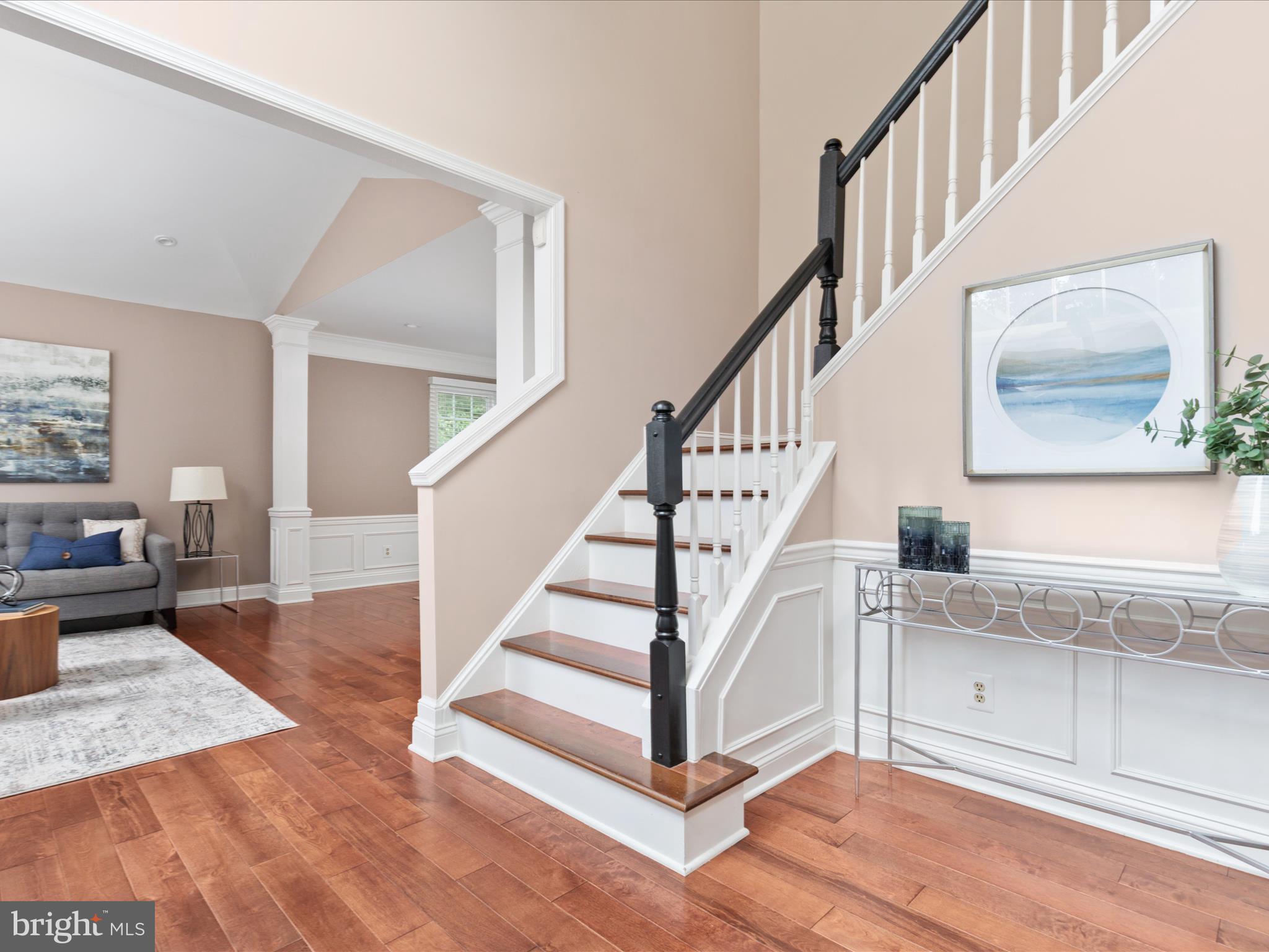 20462 Quarterpath Trace Circle Sterling, VA 20165 - Photo 5 of 58 a view of entryway and hall with wooden floor