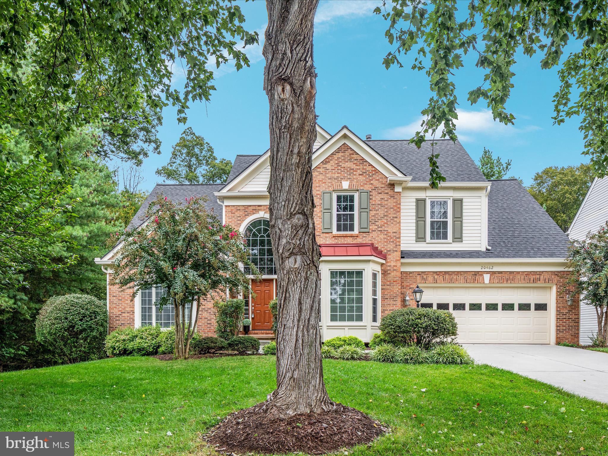 20462 Quarterpath Trace Circle Sterling, VA 20165 - Photo 58 of 58 a front view of a house with a yard and trees