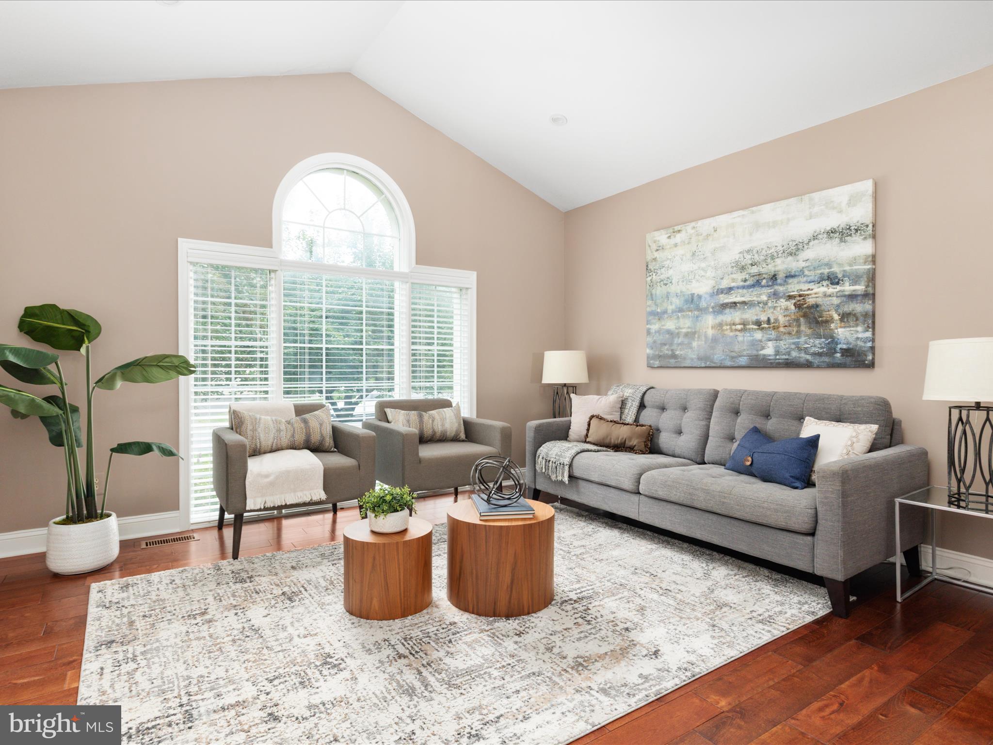 20462 Quarterpath Trace Circle Sterling, VA 20165 - Photo 6 of 58 a living room with furniture wooden floor and a large window