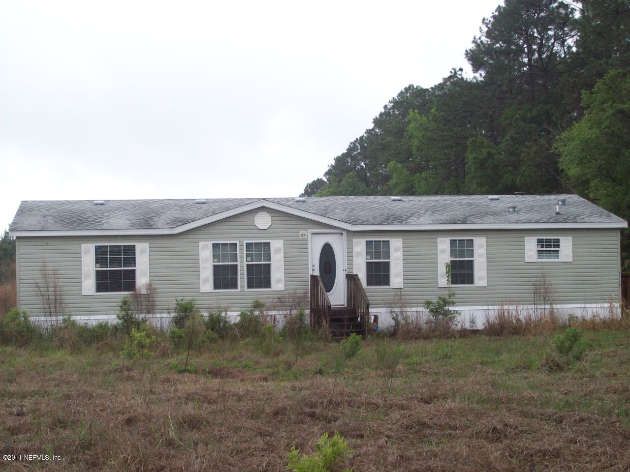 45128 Zidell Road Callahan, FL 32011 - Photo 1 of 12 a view of front of a house with yard