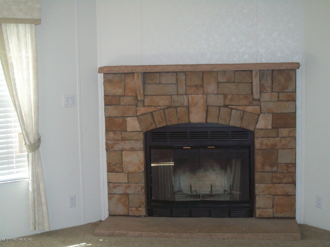 45128 Zidell Road Callahan, FL 32011 - Photo 2 of 12 a closeup of a fireplace