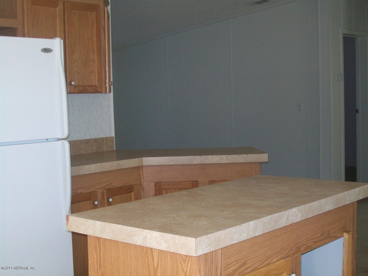 45128 Zidell Road Callahan, FL 32011 - Photo 6 of 12 a bathroom with a sink and a refrigerator