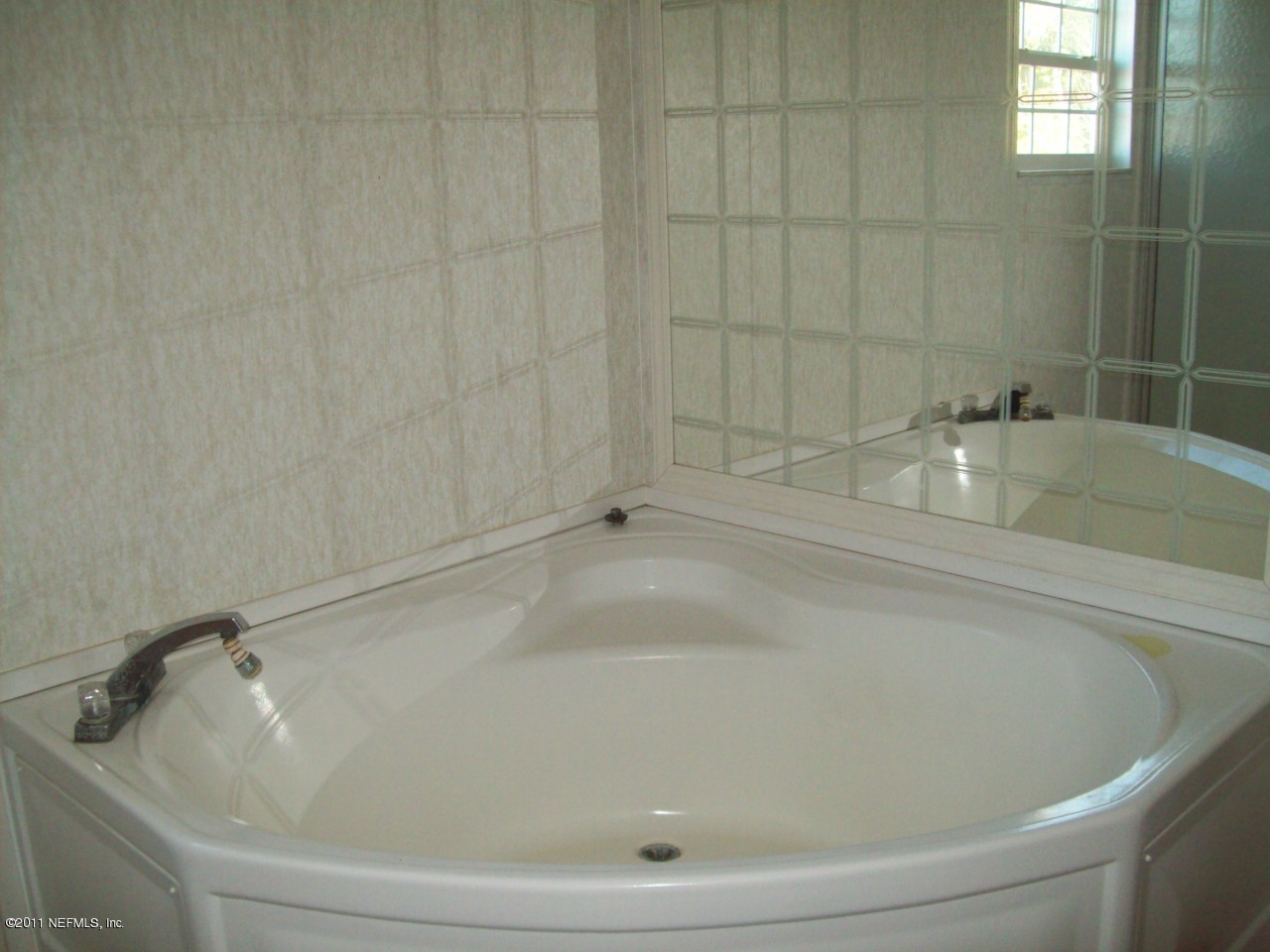 45128 Zidell Road Callahan, FL 32011 - Photo 9 of 12 a bathroom with a tub