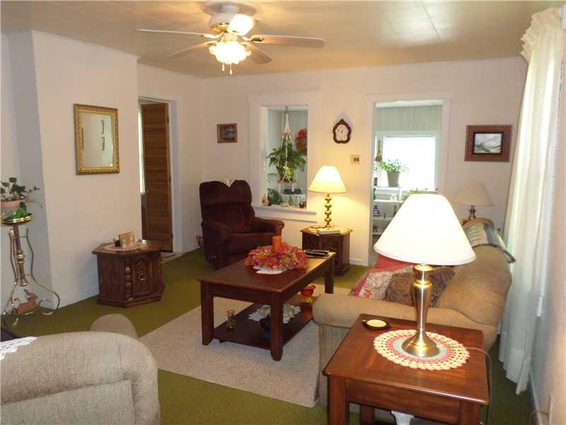 105 Allison Road Dilliner, PA 15327 - Photo 4 of 14 Living Room. Spacious living room that opens up to a sunny and pretty sunroom