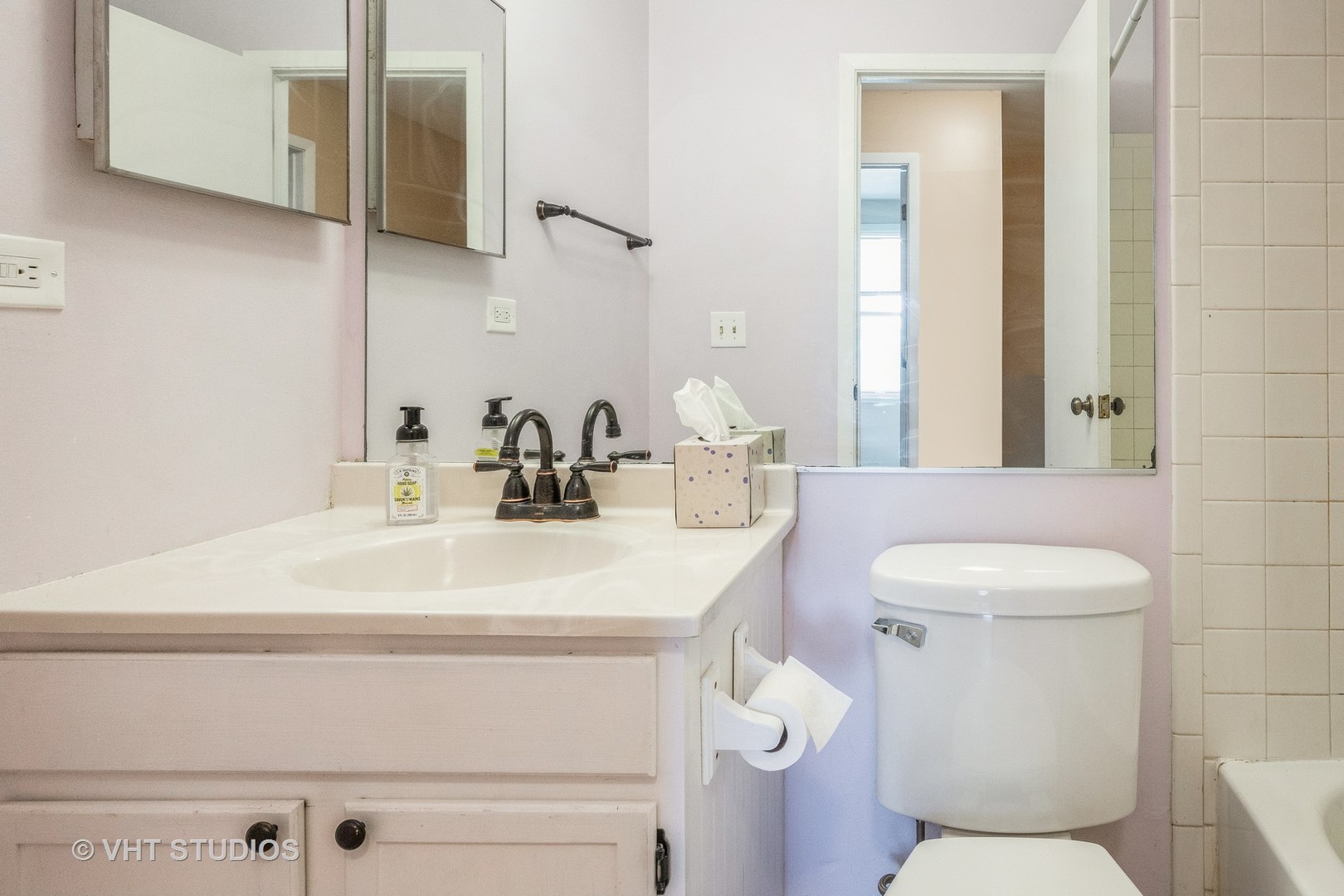 1216 Calico Avenue Naperville, IL 60564 - Photo 12 of 16 a bathroom with a toilet sink and mirror