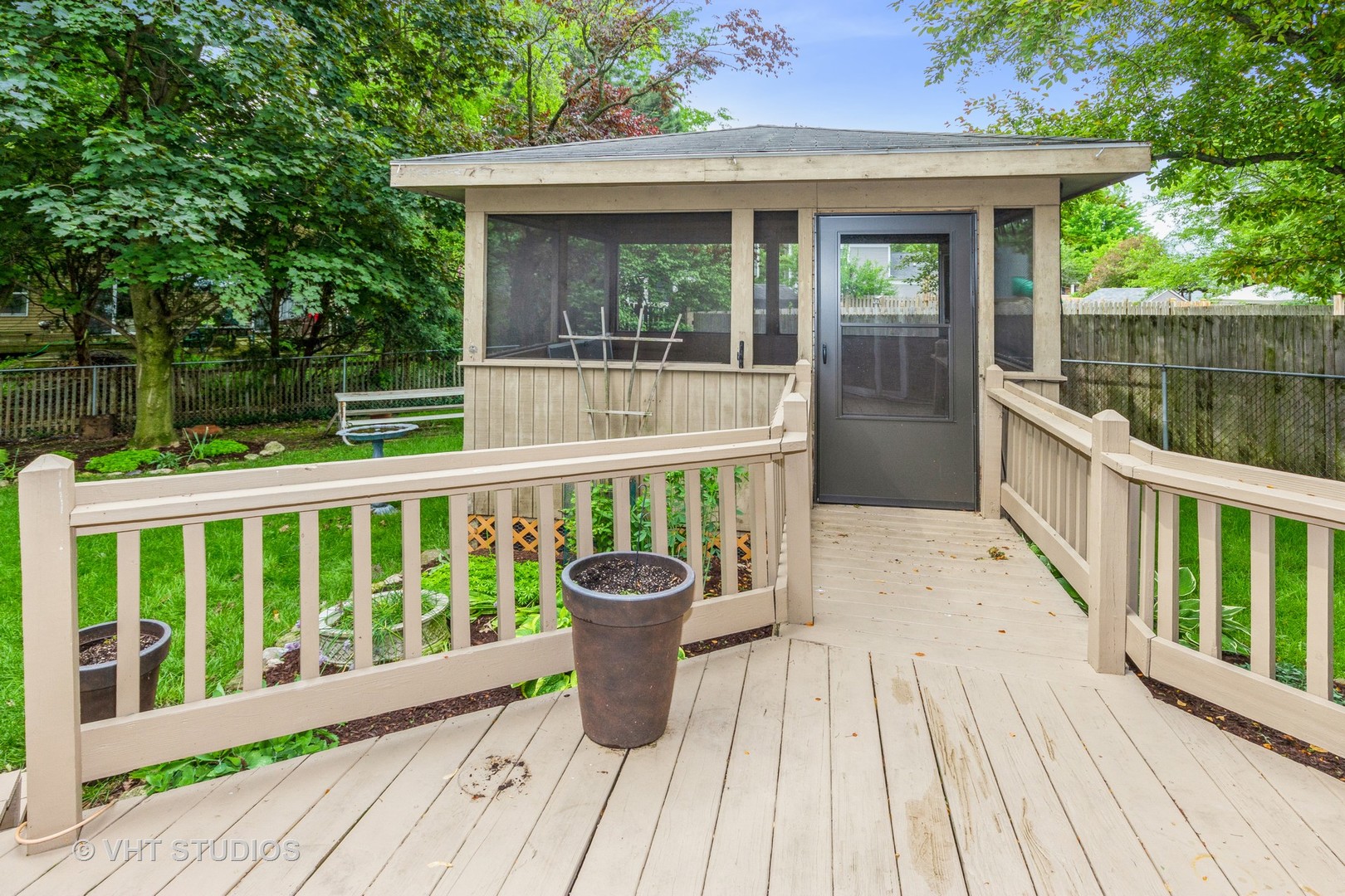 1216 Calico Avenue Naperville, IL 60564 - Photo 14 of 16 a view of a two chairs and table on the wooden deck
