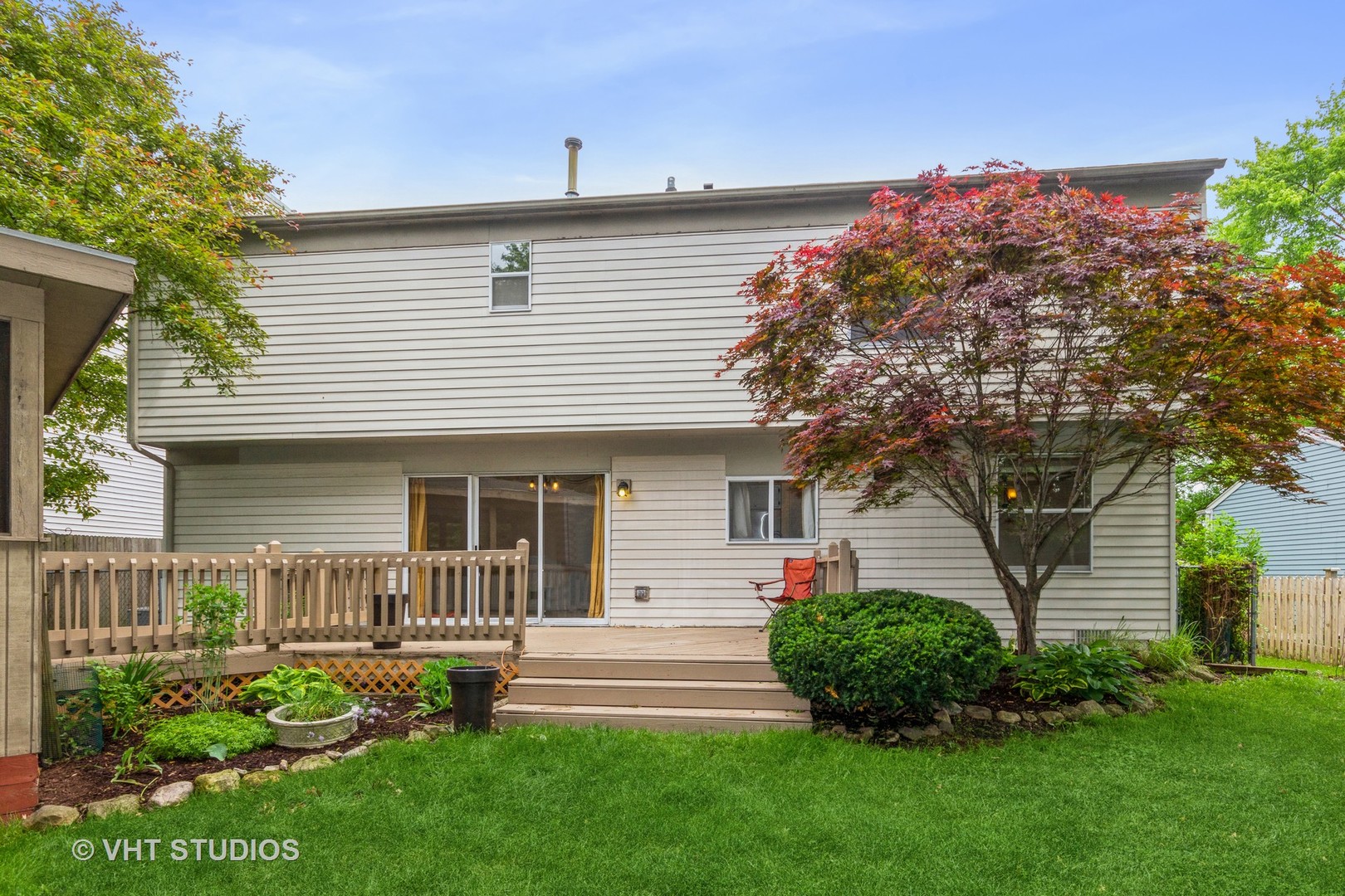 1216 Calico Avenue Naperville, IL 60564 - Photo 15 of 16 a front view of a house with a garden and plants