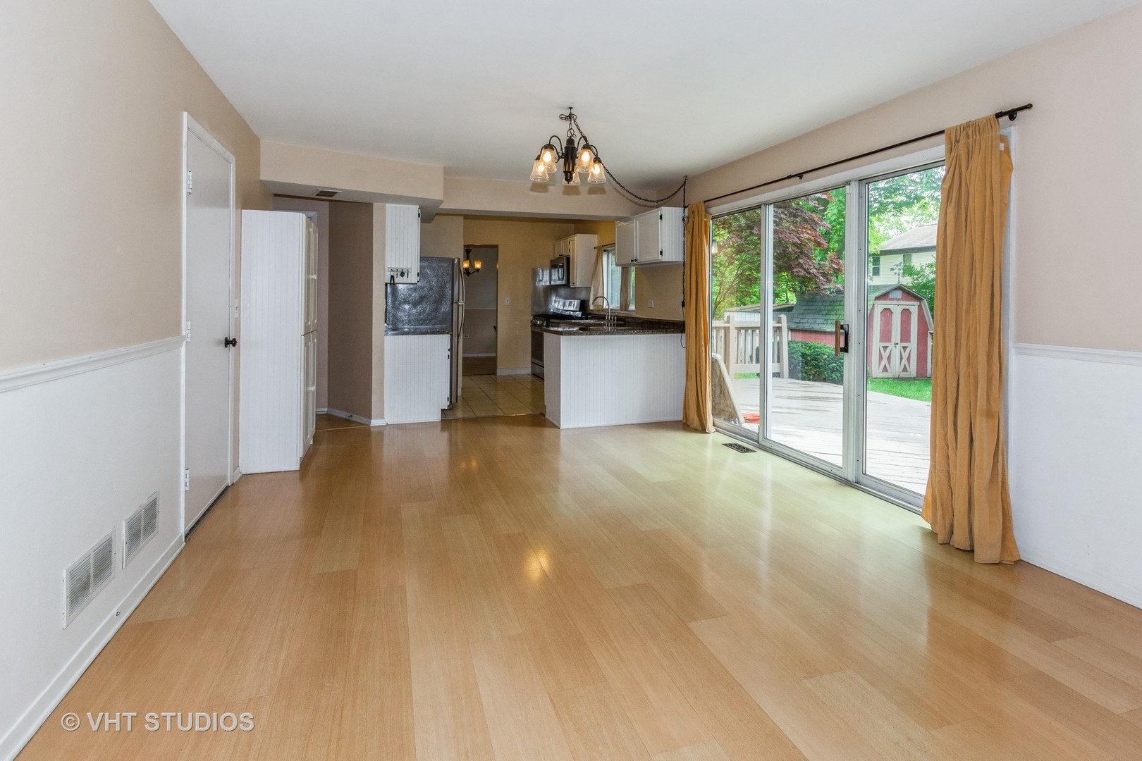 1216 Calico Avenue Naperville, IL 60564 - Photo 7 of 16 a view of a kitchen with a sink and a large window