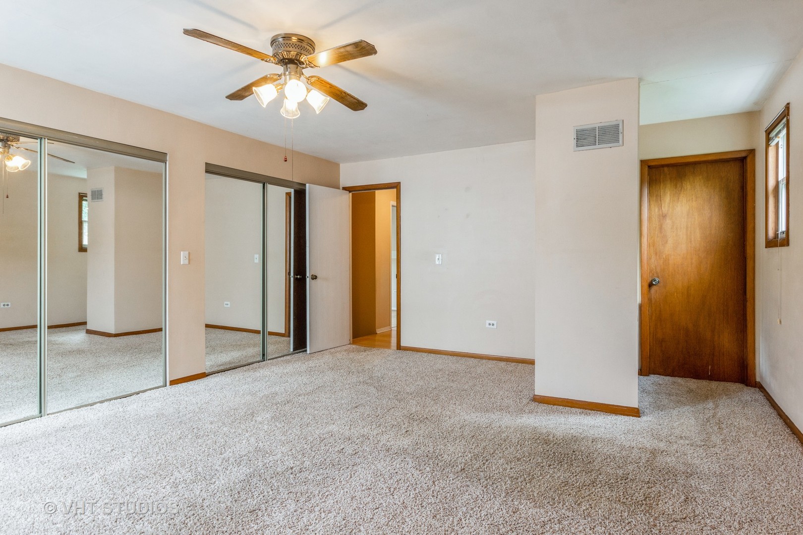 1216 Calico Avenue Naperville, IL 60564 - Photo 8 of 16 an empty room with closet and a chandelier fan