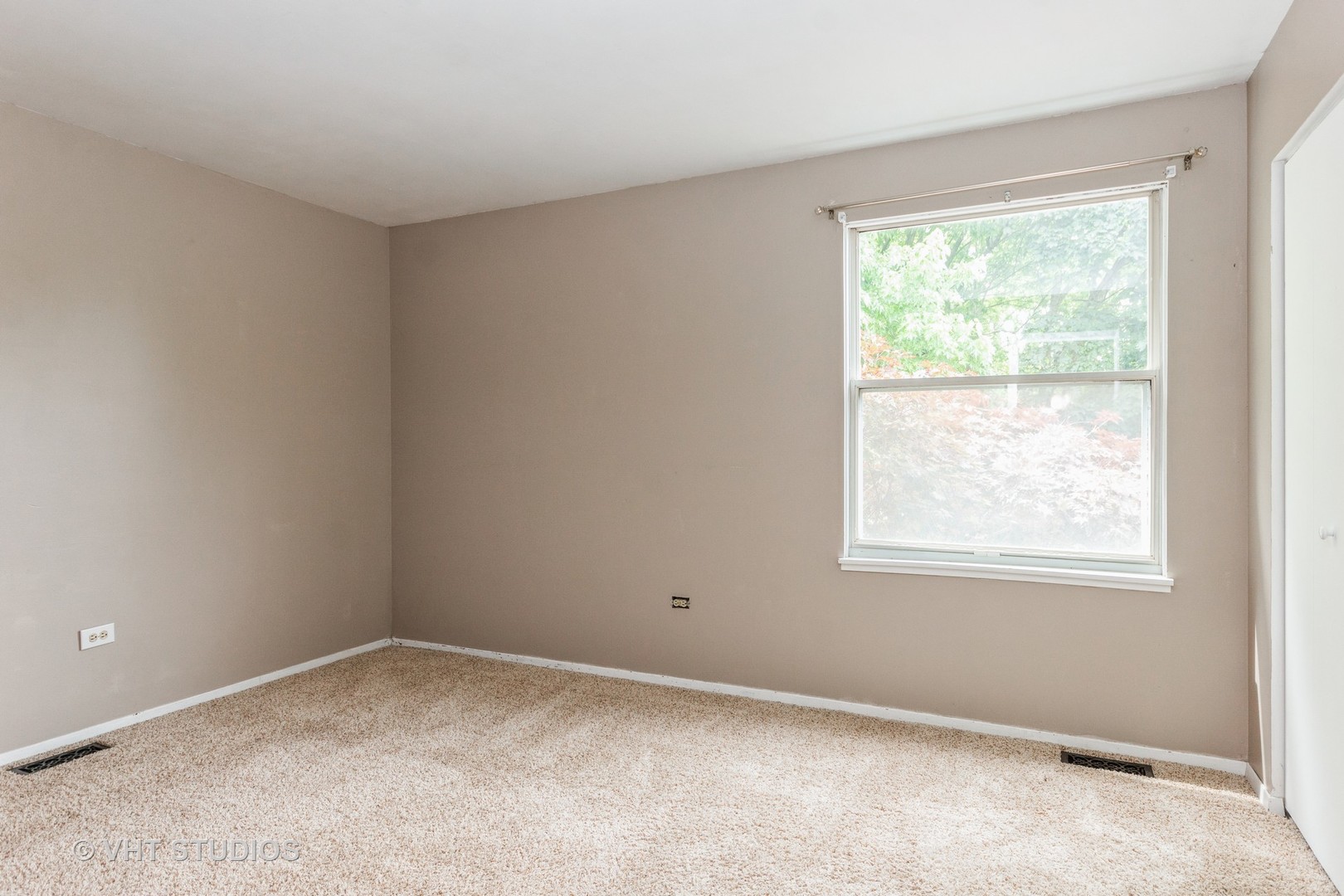 1216 Calico Avenue Naperville, IL 60564 - Photo 10 of 16 an empty room with a window