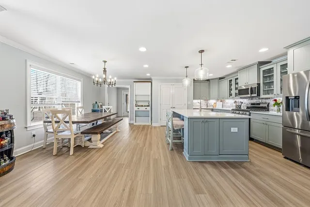 a spacious bathroom with a mirror and a shower