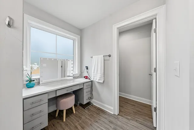 a view of a hallway with a white painted walls