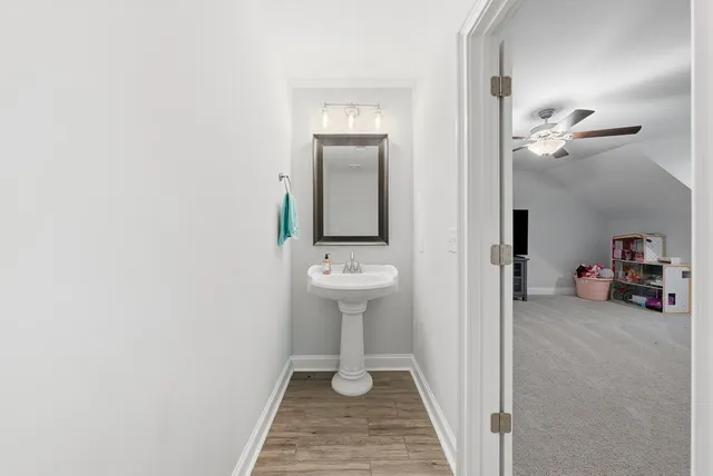 a view of a hallway with a white painted walls
