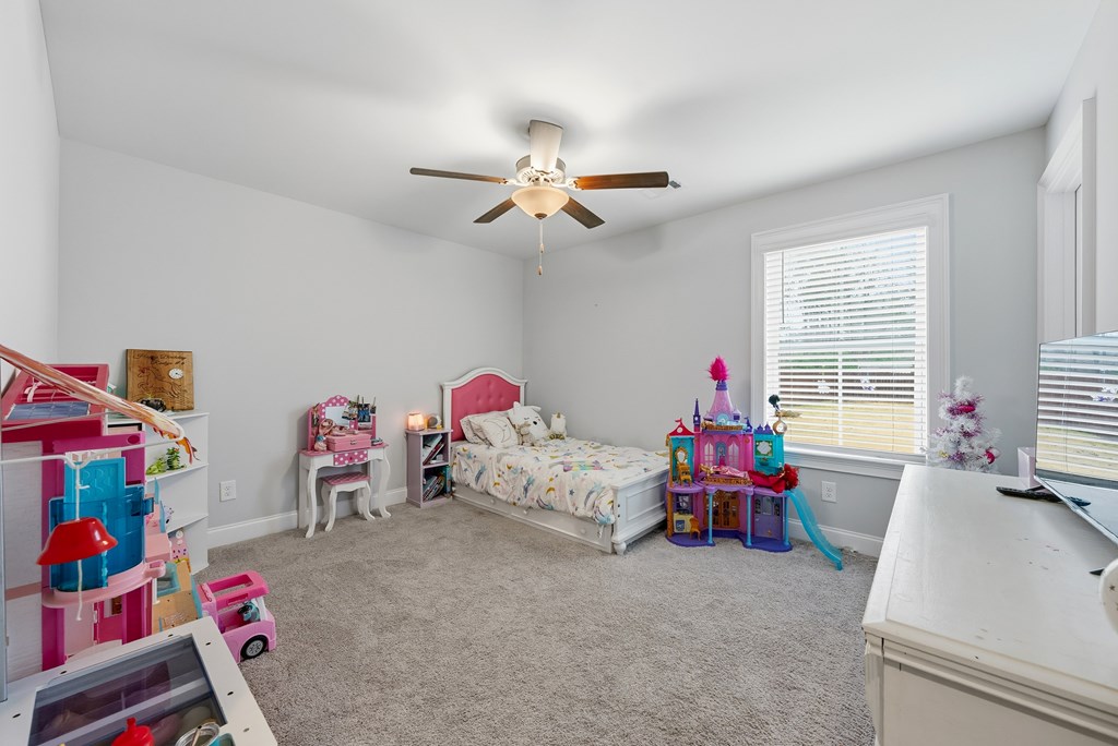 41 Loblolly Lane Fortson, GA 31808 - Photo 28 of 45 a bedroom with furniture and a window