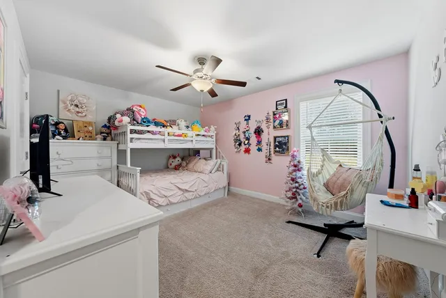 a bedroom with furniture and a chandelier