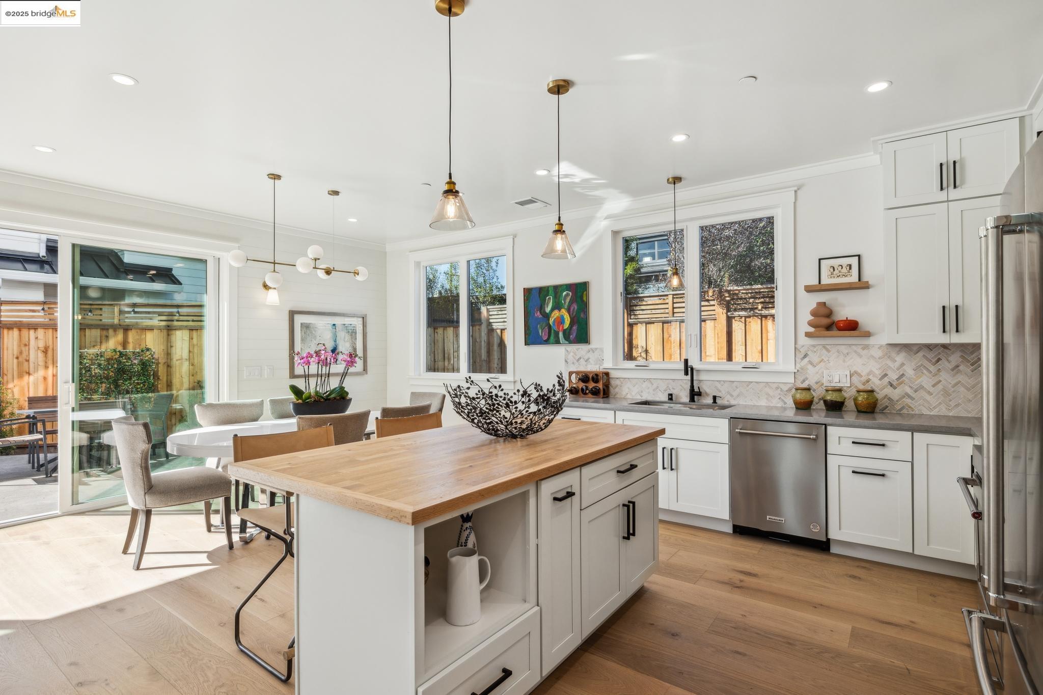2310 Eighth Street Berkeley, CA 94710 - Photo 16 of 44 a kitchen with stainless steel appliances granite countertop a stove and a wooden floors
