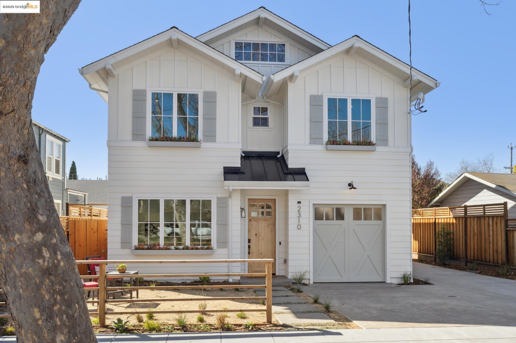 2310 Eighth Street Berkeley, CA 94710 - Photo 2 of 44 a front view of a house with a yard