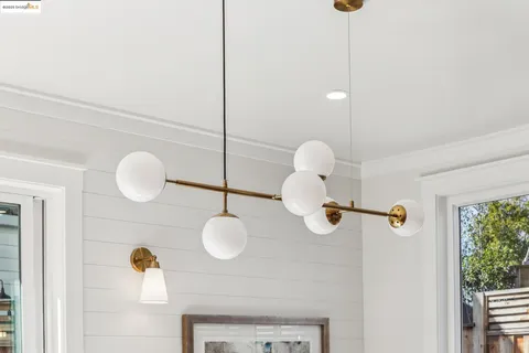 a bathroom with a mirror and a shower