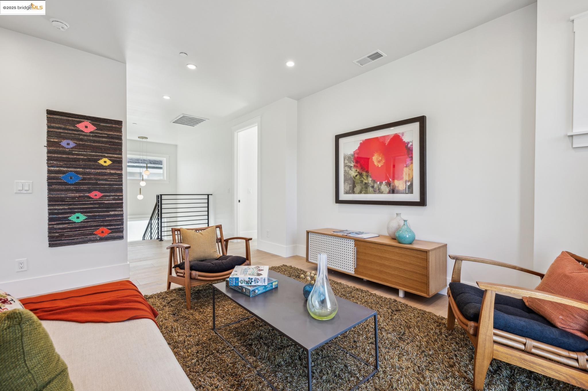 2310 Eighth Street Berkeley, CA 94710 - Photo 25 of 44 a living room with furniture and wooden floor