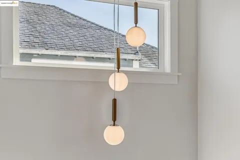 a front view of a light and hall with wooden floor