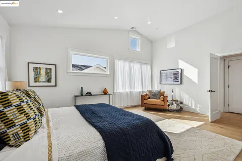 a bedroom with a bed and a couch