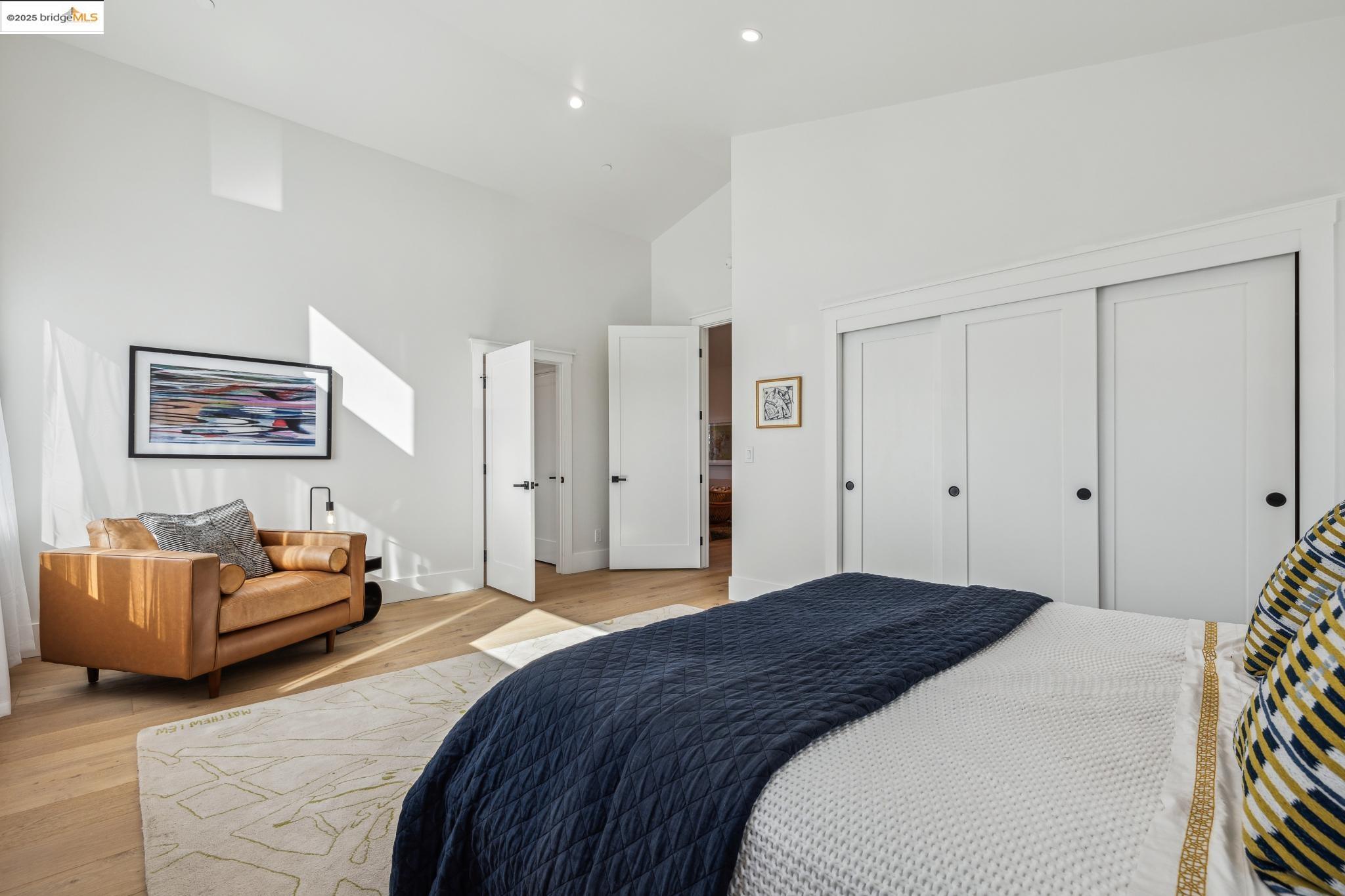 2310 Eighth Street Berkeley, CA 94710 - Photo 28 of 44 a bedroom with a bed couch and painting on the wall