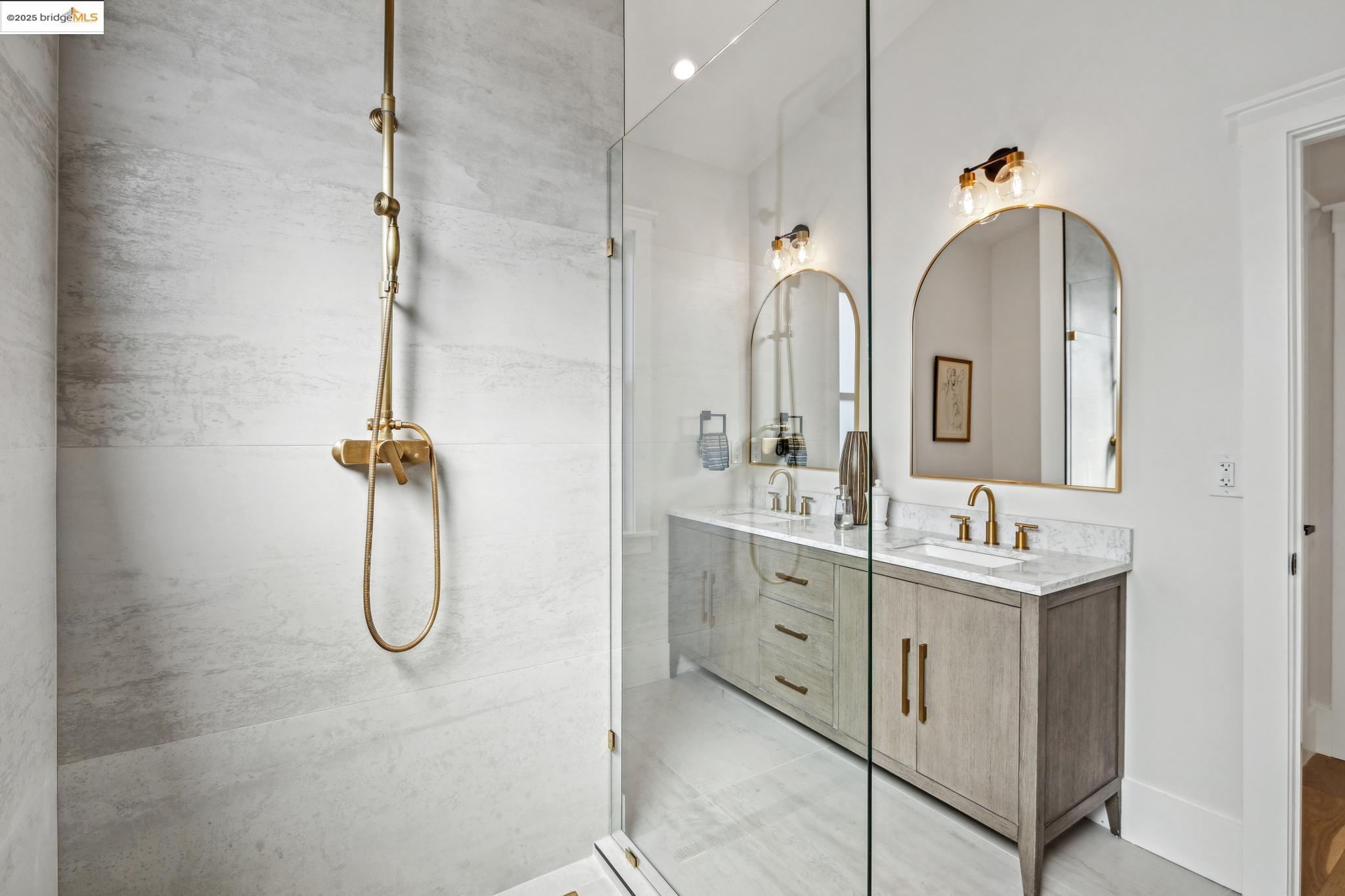 2310 Eighth Street Berkeley, CA 94710 - Photo 31 of 44 a bathroom with a shower sink and mirror