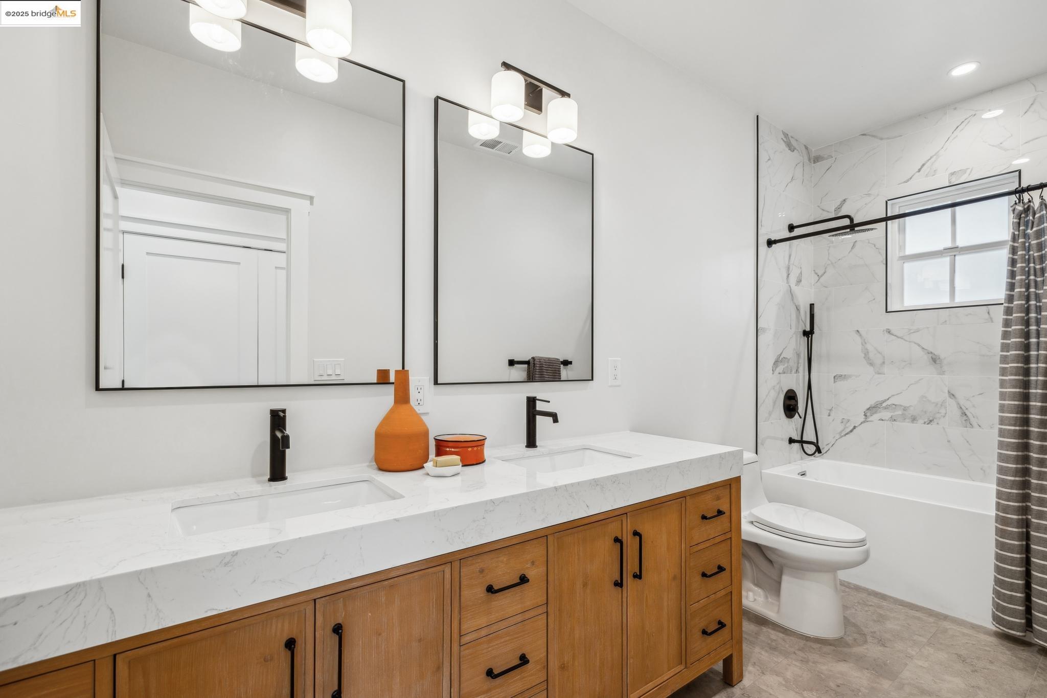 2310 Eighth Street Berkeley, CA 94710 - Photo 34 of 44 a bathroom with a sink a toilet and shower