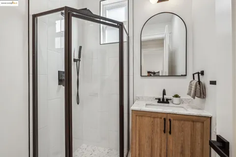 a bathroom with a double vanity sink and a mirror